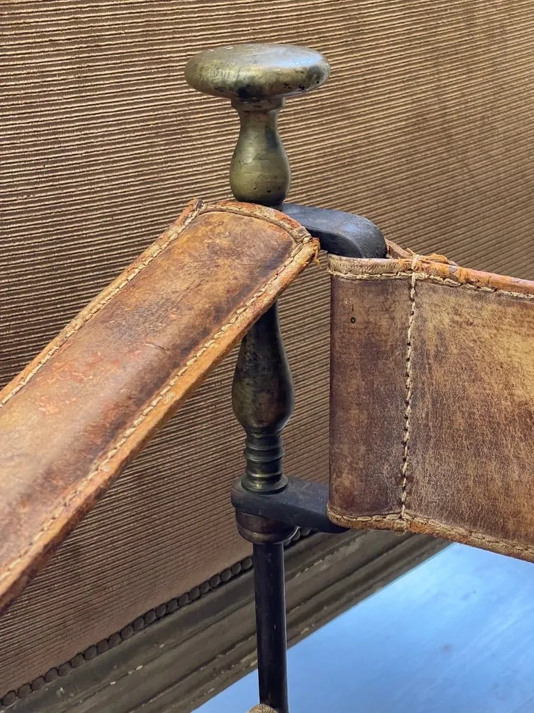 19th Century Italian iron, bronze, and leather Savonarola chair.