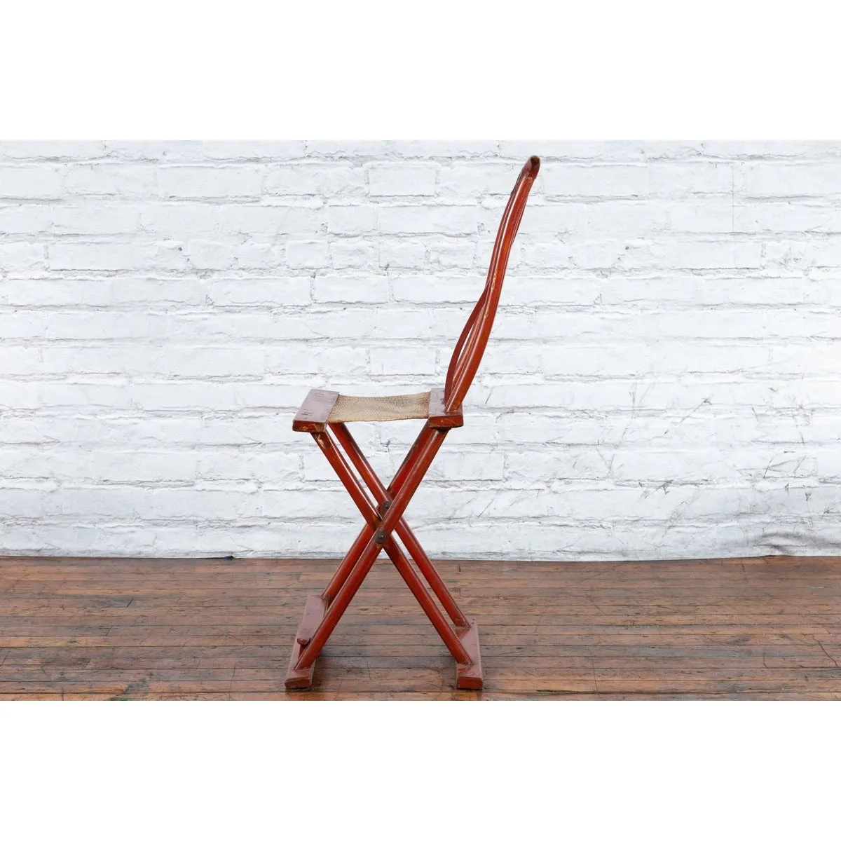 Chinese Early 20th Century Red Lacquer Traveller's Folding Chair with Woven Seat