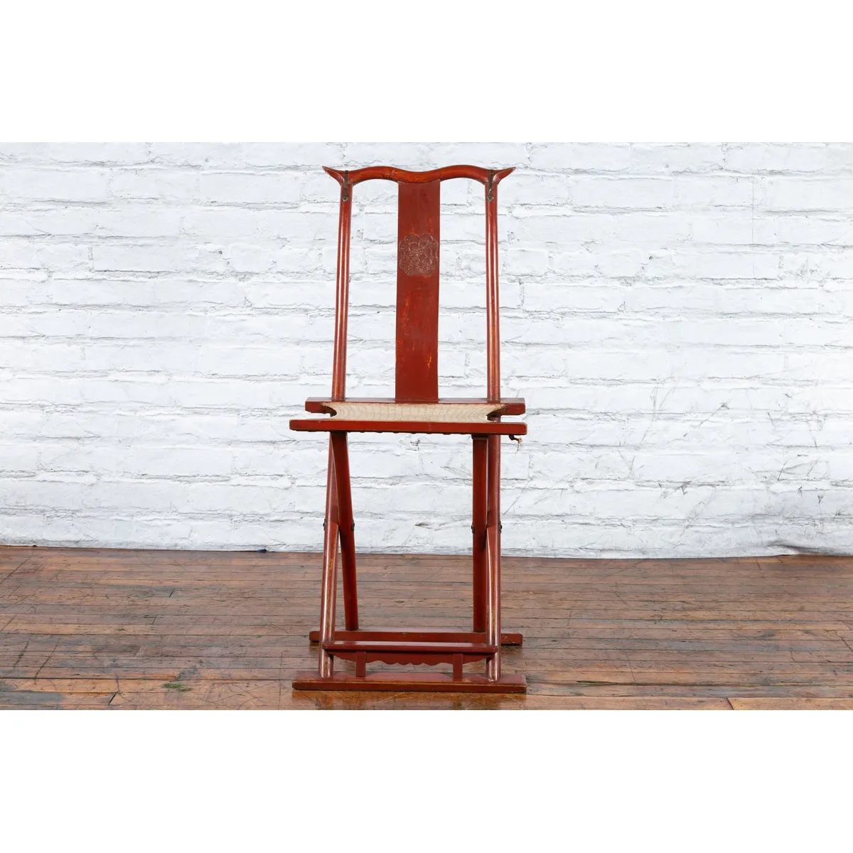 Chinese Early 20th Century Red Lacquer Traveller's Folding Chair with Woven Seat