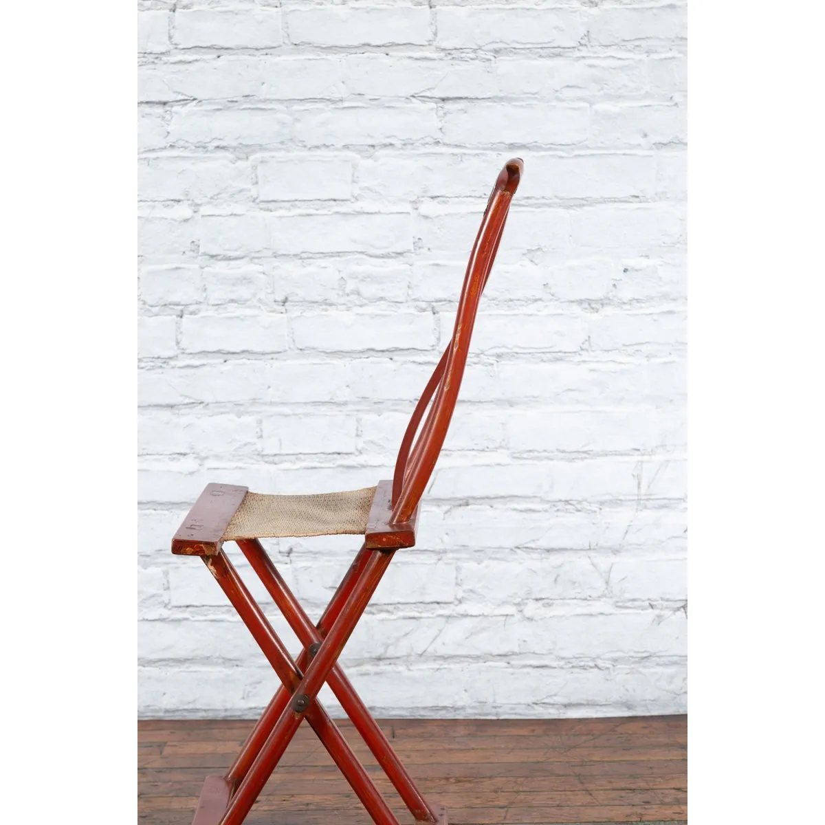 Chinese Early 20th Century Red Lacquer Traveller's Folding Chair with Woven Seat