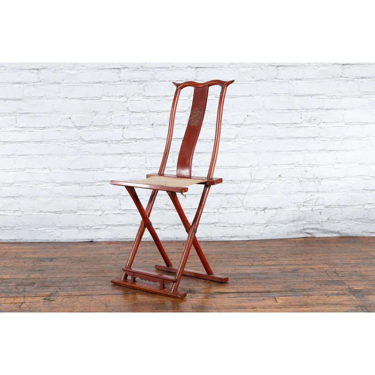 Chinese Early 20th Century Red Lacquer Traveller's Folding Chair with Woven Seat